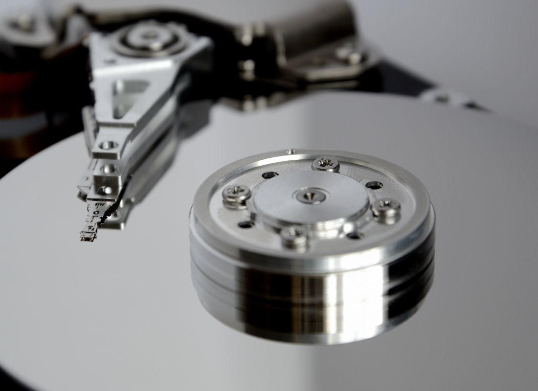 An opened hard drive — every storage device is provably destroyed before disposal