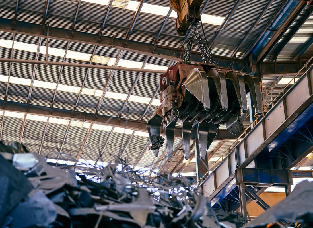 Inside a recycling facility — overhead handling and material recovery